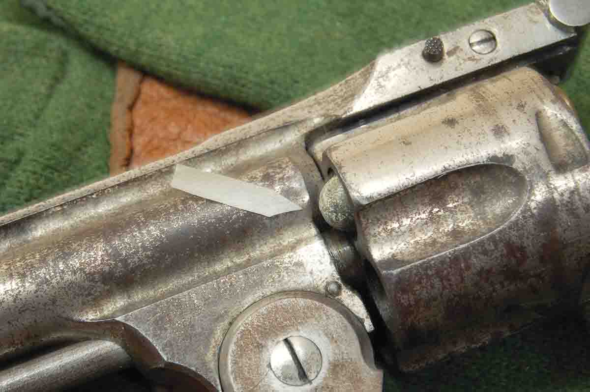 The .38 Long Colt is too long for pocket pistols designed for the .38 Short Colt (see arrow).
